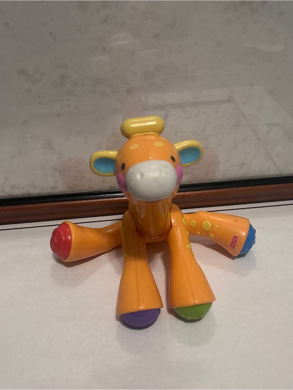 Fisher-Price Orange Giraffe Sensory Rattle with Multicolor End Caps